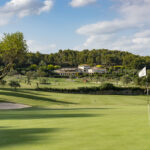 Golf Son Muntaner Green And Clubhouse Background