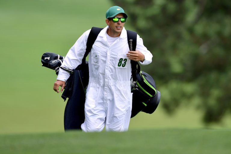 Why do caddies wear white boiler suits at the Masters?