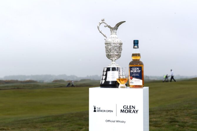 Glen Moray whisky bottle beside Senior Open trophy