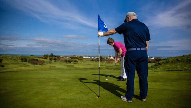 Holing out at Donaghadee Golf Club one of the many golf courses in Ards and North Down.